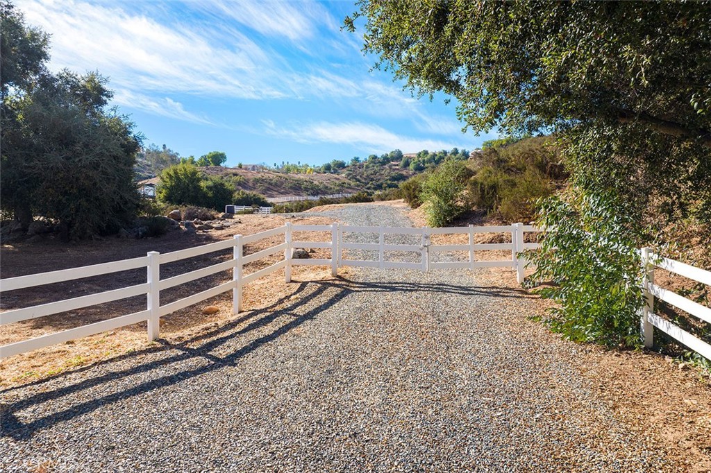 BEAUTIFUL 5-ACRE PARCEL IN A STUNNING AREA OF LA CRESTA with APPROVED GRADING PLANS AND ENGINEERED HOUSE PLANS! This location does not get any better! Loaded with giant ancient oaks and located just steps to the Cleveland National Forest, you will enjoy a peace only provided by nature. This sanctuary offers massive views from the potential house pad at the top and plenty of usable land at street level for your barn, workshop, ADU, outbuildings, horses, etc. With all the work the current owners have done, you are well on your way to constructing your dream estate in the prestigious Santa Rosa Plateau. Their hard work will not only save you time, but will provide savings of tens of thousands $$$ on engineering, perc test, and county fees. Utilities are conveniently located at the street and the parcel is already partially fenced and greets you with an inviting entry gate flanked by oak trees. This quiet location is easy – just one mile off the main road Avenida La Cresta – and is easy to view! Prepare for a magical experience! (Renderings and plans are available upon request) *****Discover the Santa Rosa Plateau Lifestyle…5-acre minimum parcels (10-acre minimum. in SR West), just minutes to schools, restaurants, hospitals, grocery stores, 15 Fwy & Temecula Wine Country. Enjoy this peaceful ranch community w/no commercial businesses, robust social activities, miles of private community trails & 1000s of acres of Ecological Reserve…All less than 1.5 hours from LA, SD, OC, Palm Springs & Big Bear. Discover the country, yet convenient, lifestyle of La Cresta, Tenaja & the Communities of the Santa Rosa Plateau!