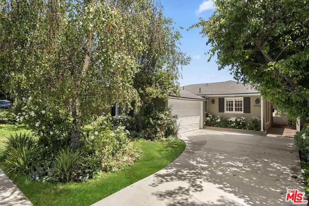 Set on a tree-lined street, 9742 Saturn St offers an enchanting traditional home with thoughtful upgrades and beautifully curated indoor-outdoor living spaces. Enter the spacious living room, bathed in natural light from skylights and large French windows, and gather around the sophisticated gas and wood-burning fireplace. Rich mahogany wood floors flow seamlessly throughout the home, adding warmth and character to every room. A wood-beam-detailed opening leads into the formal dining room, which opens through French doors to the private backyard. The bright kitchen features a breakfast counter, classic white cabinetry, a subway tile backsplash, brand-new Carrera marble counters, and stainless steel appliances. Adjacent, a large bonus den with vaulted ceilings and built-ins offers flexible space for a home office, playroom, media room, or additional guest room. The well-appointed bedrooms and recently renovated full bathroom provide comfort, while multiple outdoor living areas - including a patio with a built-in BBQ and a grassy yard surrounded by mature landscaping - create the perfect setting for al fresco dining and year-round enjoyment. Recent upgrades include a new roof, sewer line, driveway, plumbing fixtures, fresh interior and exterior paint, alarm systems/screens, and central A/C and heat. Move-in ready. This is a fantastic opportunity to own a home in the 10/10 award winning Canfield Elementary School district and in one of LA's most sought-after neighborhoods. Enjoy a prime Beverlywood location just moments from the best of Century City, Beverly Hills, and beyond.