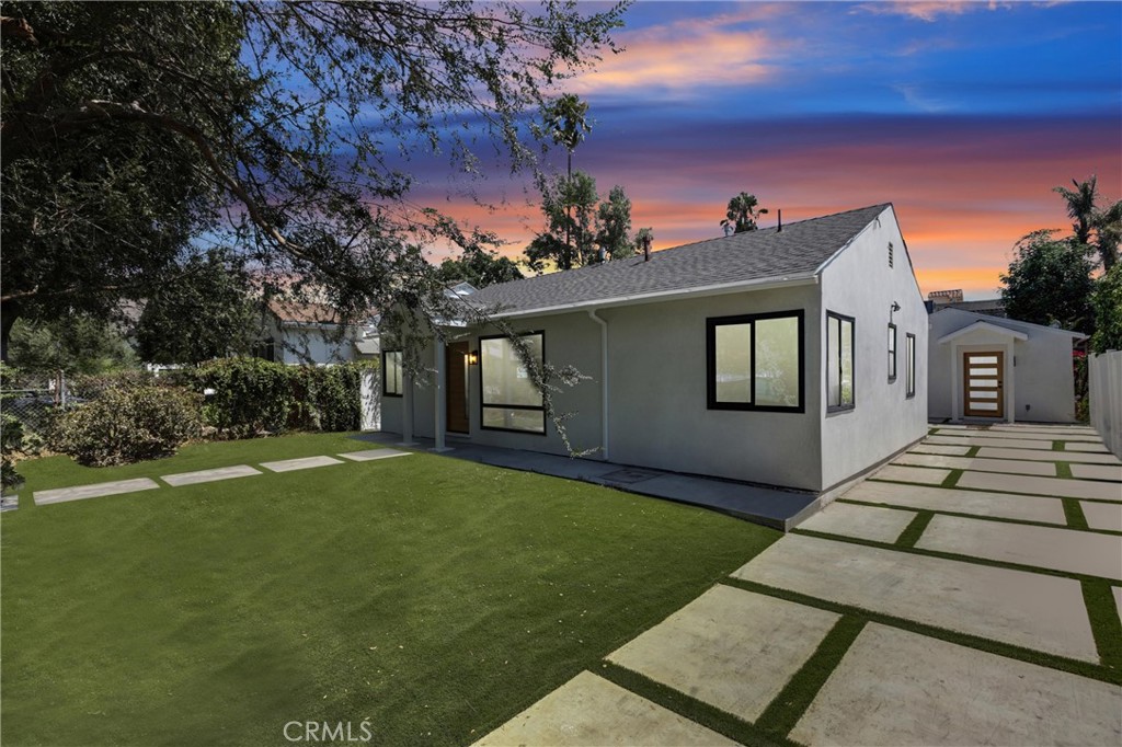 This completely reimagined luxurious home is located in a highly desired neighborhood of Sherman Oaks. Displaying an open floor plan and immaculate finishes throughout. The true gourmet center island features custom cabinetry, stainless steel appliances by Viking and Thor. There are 4 bedrooms, including a very chic primary suite featuring a large, well-organized walk-in closet and a spa-like ensuite bath. This restorative bath has a furniture-grade vanity with double sinks, decorative accent tile work, and a multi-jet rain-head shower. Two additional bedrooms share a beautiful, enlarged bathroom. The 3 bedroom main house perfectly for a family. The private backyard is perfect, has a custom patio area and grass area, separate AUD includes 1 bedroom and 1 bathroom which can be rented out for extra income. The ADU creature comforts and conveniences with a stackable washer and dryer, central air and heat, stainless still appliances makes this home not only pretty but also easy and effortless to live in. Close to all of the restaurants and shopping areas.