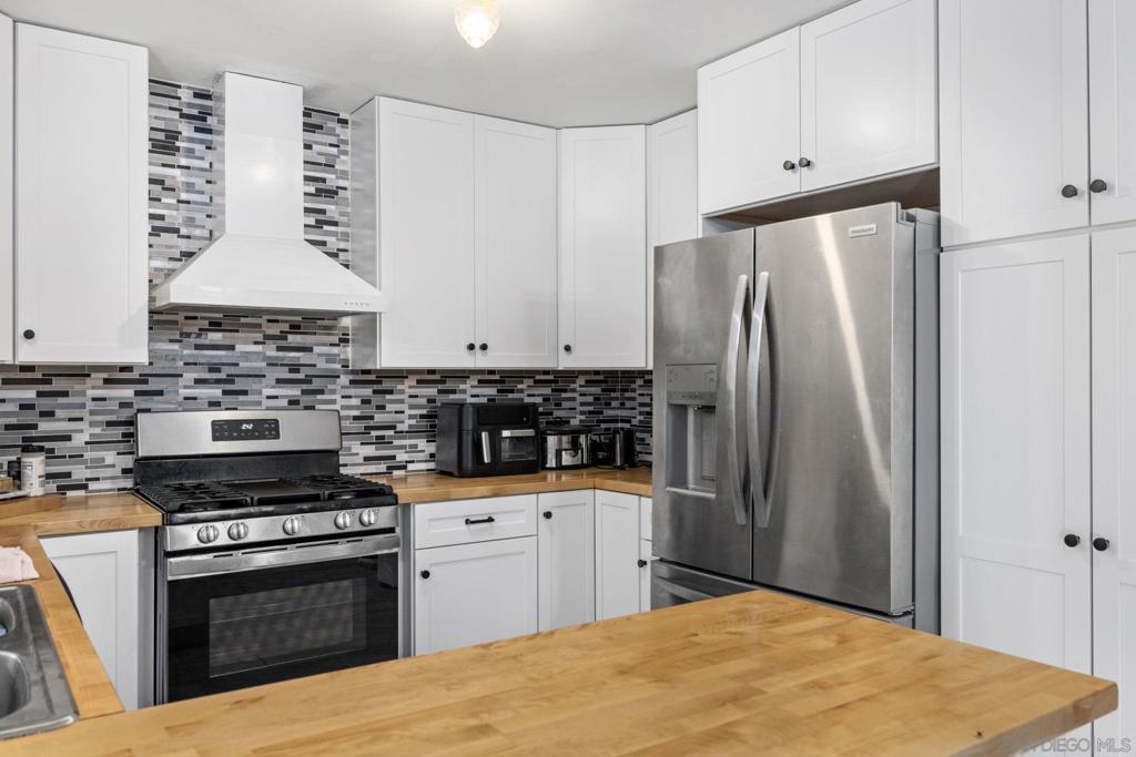 This well Kept 1800+ Sq Ft , 4 Bd 2Ba home , with recent upgrades is located in one of San Diego's most convenient neighborhoods. Upgrades include newer kitchen cabinets, counter tops. Newer flooring in down stairs rooms There is a massive all brick fireplace as a central focal point in the living room. Great for cozy evenings. The garage has been converted to a wonderful recreation/ party room. This could be easily turned back to a finished garage, if needed. The backyard is large enough to entertain, yet not a burden to maintain. The home is situated on a great street. Well kept homes all around. This home is located minutes from shops on Balboa, restaurants in the Convoy district, parks and schools from elementary to college. It is minutes from downtown and the beaches. Priced to sell.