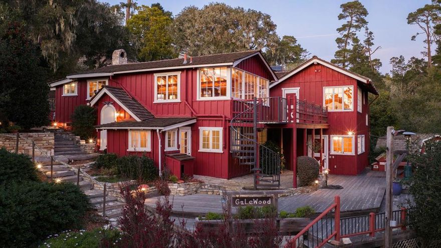 Galewood is a charming compound that carries the quiet luxury of a Carmel property held in one family for more than 50 years. Timelessly crafted, the main house offers 5 bedrooms and 4.5 baths across 3,336 SqFt, with 4 fireplaces, hardwood floors, brick tile accents, and warm redwood interiors. Tucked into its own corner of the grounds is a quaint, 878 SqFt cottage with 1 bedroom and 1 bathroom. The Barn, crafted by Daniels and House, features 665 SqFt of living space with 1 bedroom and 1 bathroom, along with a 4-car garage. Behind the Barn is a bridge connecting directly into Mission Trail Park, a 34-acre preserve with winding trails. Outdoor amenities include a dual-sport court, large deck overlooking the forest, tiered entertaining areas, lighted pathways, and lush gardens. Together, these pieces form an elevated Carmel compound with 4,879 SqFt of total living space across nearly 26,000 SqFt of land, providing an unplugged, summer-camp-like sense of escape. With its rare scale and history, the property supports multigenerational living, a generational family retreat, investment options, or a timeless legacy estate.