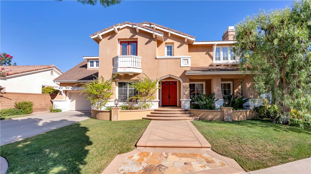 Welcome to 6 Montia, Luxury Living at its finest within the gated enclave of Arbor Crest Estates of Northwood Pointe in Irvine. Proudly offered by the original owner, this exceptional residence blends elegance, comfort, and functionality in one of Irvine’s most coveted gated communities. This home boasts 5 bedrooms with a downstairs bedroom suite (currently used as an office), 4.5 bathrooms, 4196 square feet, PLUS a large bonus room. This home’s ideal location is situated on a rare 9,240 square foot lot tucked at the end of a quiet cul-de-sac, adjacent to the Citrusglen Park, tennis courts, and Hicks Canyon Trail. Step through the double-door entrance and experience the grandness, generous natural light, and an open floor plan designed for both grand entertaining and everyday living. The formal living and dining rooms flow seamlessly together, highlighted by a gas fireplace and expansive windows. The heart of the home is the recently remodeled gourmet kitchen, featuring Quartzite countertops, sleek white cabinetry, stainless steel appliances, and an oversized center island perfect for gatherings. An inviting breakfast nook opens to the warm and welcoming family room, complete with built-ins and a fireplace. As you head up the dramatic rounded staircase you will encounter a luxurious spacious primary suite with custom built-ins and a primary bath with dual vanities, soaking tub, walk-in shower, and a large walk-in closet. In addition, there are 2 built-in workstations that lead to a large bonus room, complete with ample storage. Completing the upstairs are 3 additional bedrooms perfect for more space and comfort, one bedroom includes an ensuite bathroom and two bedrooms share a Jack-and-Jill full bathroom. Back downstairs, French Doors lead to the spacious backyard, designed for relaxation and entertaining, with lush landscaping, ample patio space, and a built-in BBQ island. A 4-car tandem garage with expansive oversized driveway is a big feature for this estate home. The Community Amenities allow you to enjoy access to Citrusglen Park and Meadowood Park, a resort-style pool, spa, tennis courts, parks, walking trails, open green spaces and much more. Tthe Schools - Enjoy highly ranked worldclass schools that are within walking distance, Northwood High School and Canyon View Elementary. This rare offering at 6 Montia combines an unbeatable location, spacious design, and timeless elegance — the perfect place to call home in Northwood Pointe.