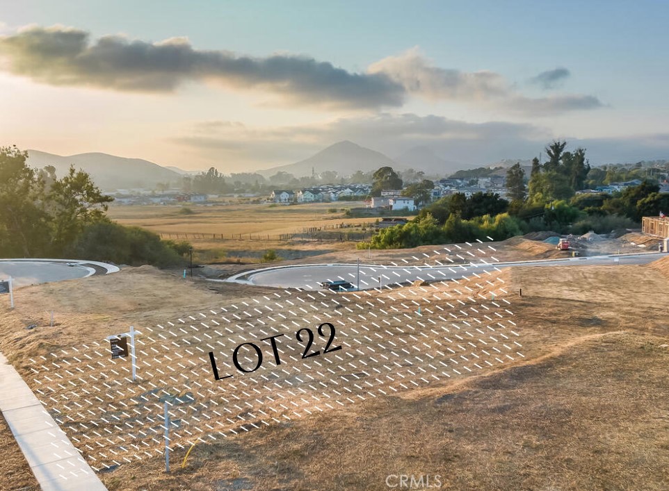 Quarter-acre Custom Homesite — one of the largest and most desirable lots available in San Luis Obispo. Located within one of the city’s newest premier communities, Lot 22 offers an exceptional opportunity to build a custom home with convenient access to downtown, wine country, and the regional airport.
Set amid the rolling hills of the vibrant Righetti Ranch community, this exclusive enclave of just 34 residences redefines luxury living—where timeless architectural styles blend effortlessly with California’s rich heritage and natural beauty. Ideally situated near the end of a quiet cul-de-sac, Lot 22 offers exceptional privacy, sweeping hillside views, and optimal sun orientation.
With ample space for a pool, expansive yard, outdoor kitchen, and lush landscaping, the homesite provides rare flexibility. It can accommodate a three-car garage, if desired, and a thoughtfully designed floor plan with all main living areas on the first level.
The Enclave is the final luxury neighborhood within Righetti Ranch—more than a decade in the making and now realized with refined streetscapes, curated architecture, and an enduring commitment to quality. Residents enjoy access to walking and biking trails, a future park, future community gardens, and open spaces inspired by the agricultural roots and natural beauty of San Luis Obispo County.
This is more than just a lot—it’s a lifestyle. A rare opportunity to build your dream home in one of San Luis Obispo’s most thoughtfully designed and sought-after communities. Bring your vision to life—surrounded by beauty, serenity, and convenience.
