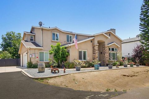 Photo of 9111 Tropico DR, La Mesa, CA 91941 (MLS # 260014096SD)