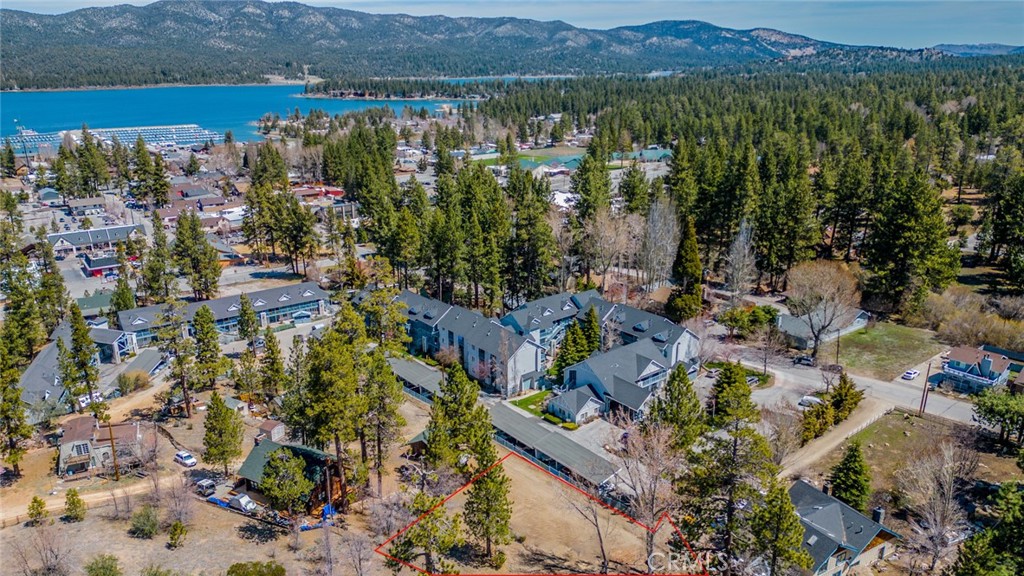 ****PRICE IMPROVEMENT!!! This exceptional property's PRIME location in Big Bear Lake offers a rare opportunity to build a dream home, mountain retreat or investment property! Situated off the main road, in a serene and private setting, this expansive residential lot spans nearly 1/2 acre at 21,000 sq ft, zoned R-3 for multifamily development, presenting a multitude of possibilities! You are walking distance to the village and Big Bear Lake with easy access to all utilities. Buyer to do own due diligence with respect to utilities, footage, and city requirements! Don't miss this opportunity to own a piece of paradise! An address has not been assigned. Photos 11 and 12 were AI generated to demonstrate remarkable potential.