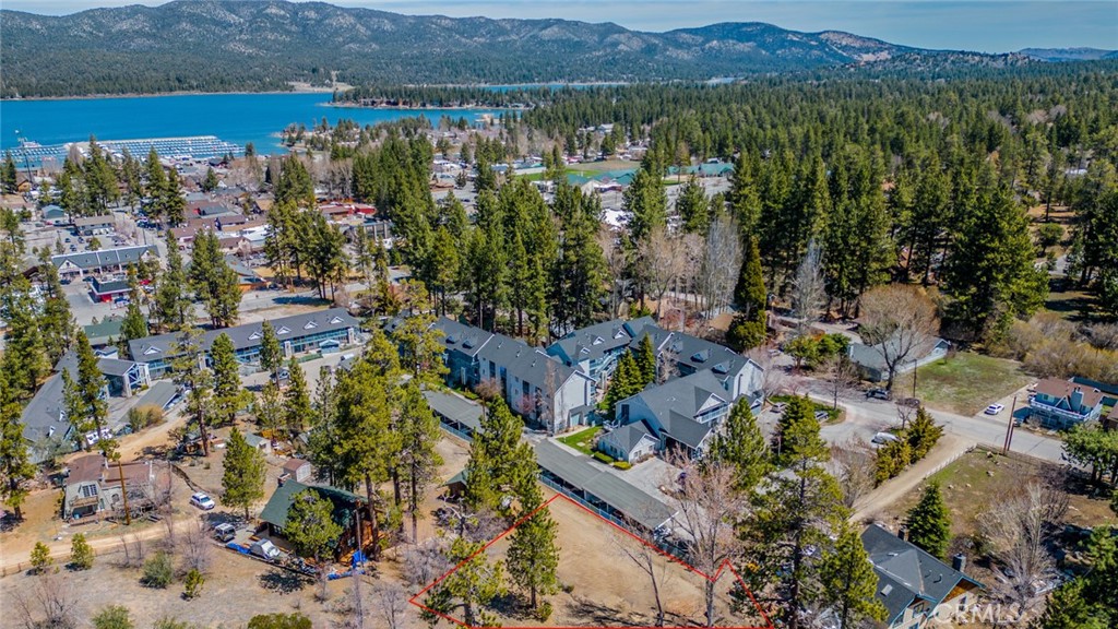 This exceptional property's PRIME location in Big Bear Lake offers a rare opportunity to build a dream home, mountain retreat or investment property! Situated off the main road, in a serene and private setting, this expansive residential lot spans nearly 1/2 acre at 21,000 sq ft, zoned R-3 for multifamily development, presenting a multitude of possibilities! You are walking distance to the village and Big Bear Lake with easy access to all utilities. Buyer to do own due diligence with respect to utilities, footage, and city requirements! Don't miss this opportunity to own a piece of paradise! An address has not been assigned.