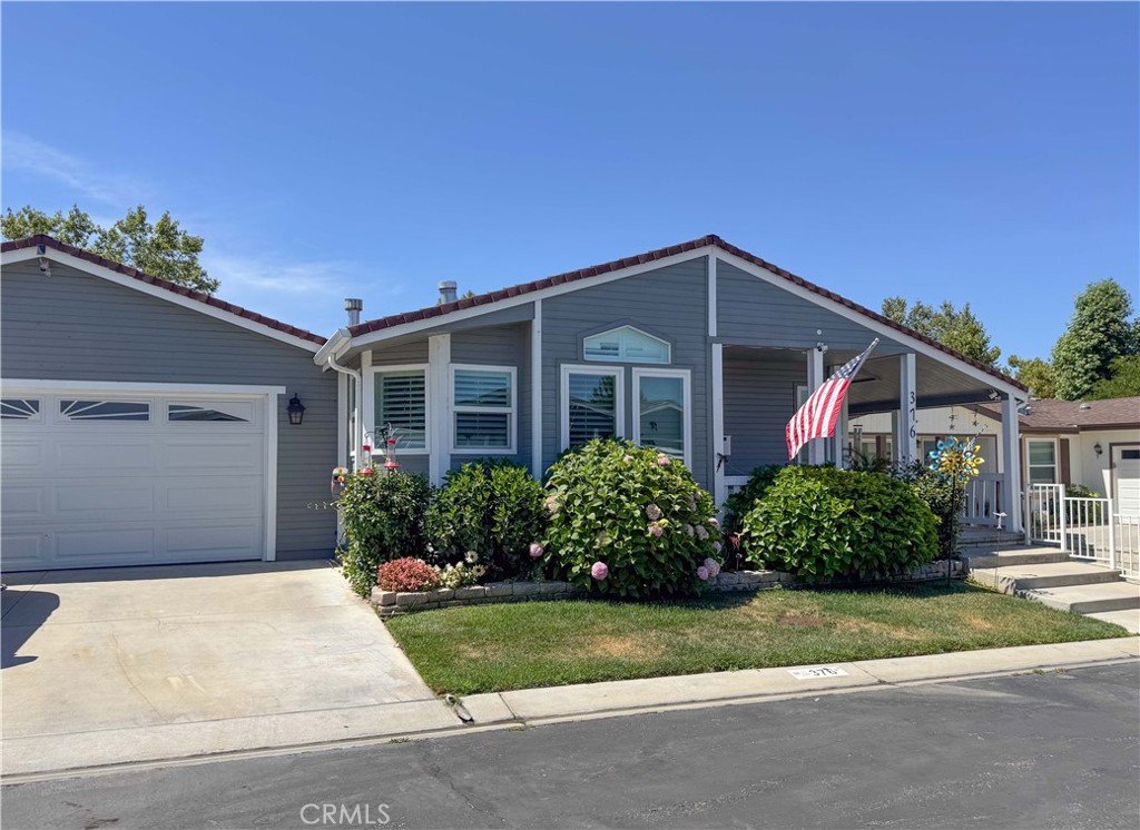 Beautiful home in a highly sought after 55+ community with resort style living! This home has 2 bedrooms, 2 baths, den, fireplace, fenced in backyard, front porch & loaded with upgrades. The laminate flooring is always a plus, newer dual pane windows can certainly assist with energy efficiency as well as the newer a/c condenser. The kitchen cabinets and counter tops have all been upgraded, there are chandeliers in various rooms some with retractable fans that will also remain with the home. The utility room has a 9-cupboard pantry for those extras that need to be put somewhere and is conveniently attached to the 2 car garage. This home also has a fenced in back yard, covered patio, great for barbecues, a jacuzzi & 2 water fountains that remain with the home.