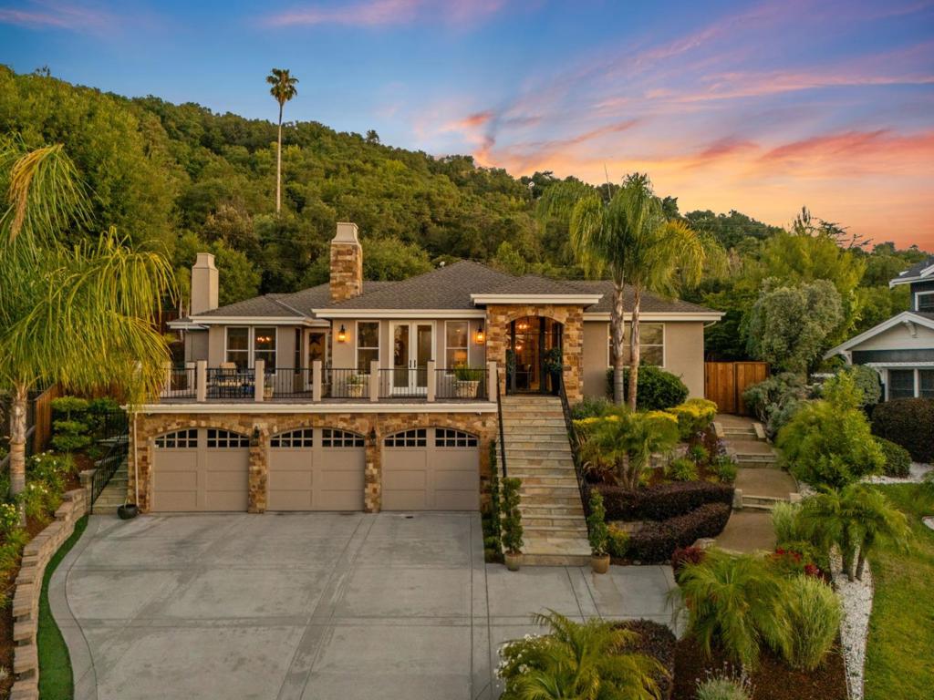 Rare opportunity to own a custom luxury estate offering 5 bedrooms, 5 bathrooms, and 3,851 square feet of thoughtfully designed living space on a private 0.32-acre lot. Built in 2004 by renowned local builder Steve Nazzal, this home is a showcase of quality craftsmanship, timeless architectural detail, and elevated design. Step inside to soaring ceilings, high-end fixtures and finishes, a dedicated wine cellar, and a custom wet barperfect for entertaining. A full, extensive remodel was completed in 2022, blending modern updates with the home's original architectural charm. Energy efficiency is another standout feature, with a fully paid-off solar system and battery backups that dramatically reduce utility costs. The expansive 473-square-foot front deck offers an ideal setting for gatherings or quiet mornings with sweeping views of Silicon Valley. The professionally designed backyard is low-maintenance yet lush, featuring a custom-built waterfall and mature greenery that create a private, resort-like escape. An oversized 759-square-foot 3-car garage provides generous space for parking, storage, and hobbies. With its exceptional build quality, luxurious indoor-outdoor living spaces, energy efficiency, and prime Los Gatos location, this is one of the area's finest custom homes.