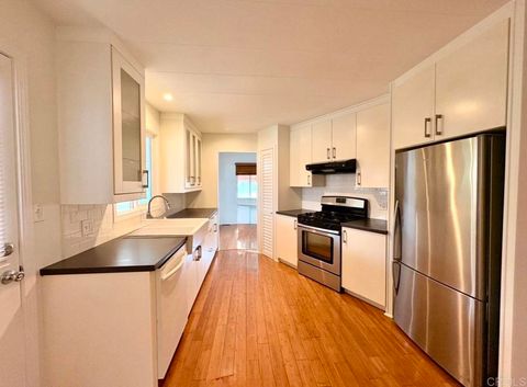 Photo of 7127 Santa Barbara Street #113, Carlsbad, CA 92011 (MLS # NDP2604065)