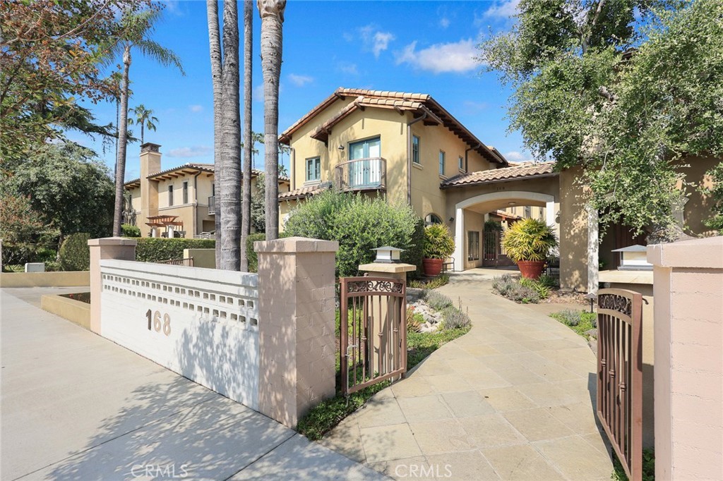 Sophisticated single-living in the highly regarded Town & Country enclave offers timeless design and a welcoming sense of home. With its Tuscan-inspired architecture and beautifully landscaped courtyards, the community radiates charm, character, and quiet luxury. This thoughtfully designed single-level home features a spacious, open-concept layout enhanced by new wide plank deluxe vinyl flooring, European-style porcelain tile, and plush Berber carpet(bedrooms only). The kitchen blends style and function with high-end appliances, custom-stained cabinetry, quartz countertops, frosted glass accents, and an enclosed laundry area across the way. The primary bedroom offers a spacious walk-in closet with tailored custom cabinetry, French doors with a retractable screen open to a private strip of yard—perfect for a bit of container gardening or simply enjoying the fresh air. The generous utility room has also been enhanced with custom-built-ins for optimal storage. Additional highlights include Andersen E-Series dual-pane windows, Plantation shutters, multi-zone HVAC, high-quality doors, and AT&T optical fiber. A private two-car garage with elevator access next to the unit makes daily living effortless. Perfectly positioned just minutes from Lake Avenue’s shopping and dining, The Huntington Library and Gardens, and the vibrant culture of Old Town Pasadena. Top-tier schools such as Caltech, Polytechnic, Mayfield, and Westridge are all nearby, along with walkable access to markets, restaurants, and public transportation. This home offers a rare combination of comfort, sophistication, and location—a place where style meets substance.