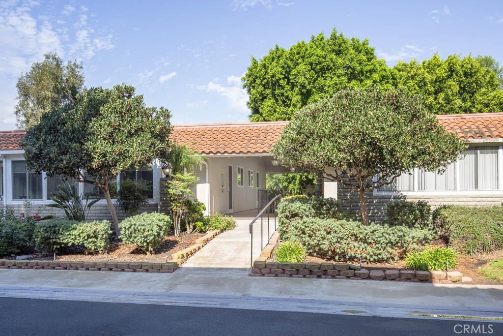 Stunning Designer-Remodeled 2bd 2ba Casa Vista in the 55+ community of Laguna Woods! This beautiful fully renovated home has been transformed by the owner, a professional designer, with high-end finishes and thoughtful details throughout. The open kitchen features quartz countertops with a striking waterfall edge on the service bar, a custom tile backsplash, smooth-close cabinetry, and stainless steel appliances. The dining area features added storage cabinets and a wine fridge. This open concept home features smooth ceilings, dual pane windows, zoned heating/cooling, ceiling fans, and luxury vinyl flooring for stylish modern comfort. Enjoy seamless indoor-outdoor living with a large private patio with stunning views accessible from both the living room and guest bedroom. Both bathrooms have been completely remodeled with step-in showers and designer tile work and motion sensor lighting. Additional highlights include a high-end washer/dryer and elegant designer touches in every room. Most of the furniture is available at a negotiated price. Residents of Laguna Woods Village enjoy country club style living with its many amenities including 7 clubhouses, 5 swimming pools, 3 gyms, a championship 27-hole golf course and a 9-hole 3 par executive course. There are over 250 social clubs, craft studios, a performing arts theater, pickleball, tennis courts, equestrian trails, stables, golf cart paths, lawn bowling, bocce ball, pickleball, fare-free bus service, manned security gates, and much more. The Village is conveniently located near beautiful Laguna Beach, shopping, medical services, hospitals, and the 5 freeway. Carport Space 3106-8