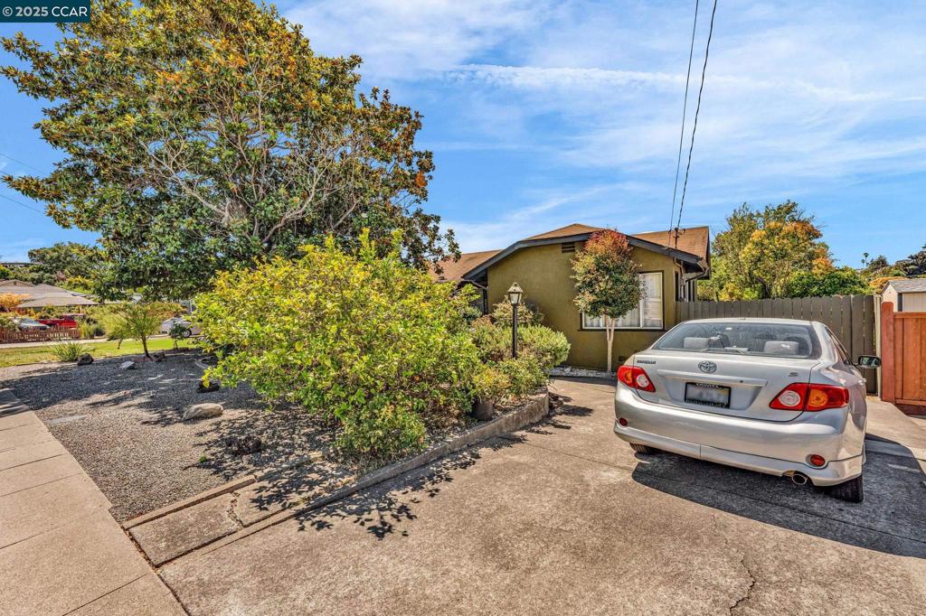 Welcome to 2573 Tara Hills Drive, a charming single-family home nestled in the tranquil Tara Hills neighborhood of San Pablo, CA. This home is a perfect blend of comfort and functionality, offering three spacious bedrooms and a well-appointed bathroom, all within 1,288 square feet of living space. Step inside to discover the warmth of original hardwood floors that add character and charm to the home. Cozy up in the inviting living room and family room for both relaxation and gatherings. The kitchen is efficiently laid out, making meal preparation a breeze, while still allowing room for personalized upgrades. Outdoors, you’ll find a generous 9,180 square foot lot that offers a private outdoor space, ideal for gardening, entertaining, or simply soaking up the sun. The detached garage at the rear of the property provides convenient parking and additional storage options. Laundry is made easy with the inclusion of both a washer and dryer, ensuring that everyday chores are handled with ease. With parking included, coming home is always hassle-free. All of these wonderful features are wrapped up in a peaceful suburban setting with easy access to major transport routes. Experience a smart investment in a home that offers both comfort and potential. OH Sat/Sun 2-4PM