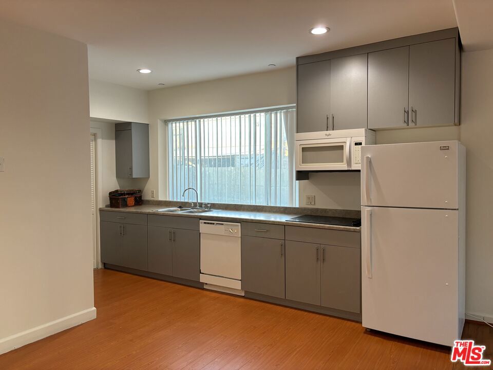 This beautifully studio apartment offers a comfortable and spacious living experience. As you step inside, you'll be greeted by a well-designed layout that maximizes privacy and functionality. The living room features large windows, allowing natural light to fill the space and providing stunning views of the surrounding area. The kitchen comes fully equipped with new refrigerator, stove and microwave, sleek cabinetry, and plenty of counter space, making it a joy to cook and entertain in. It also features new washer and dryer. The apartment boasts laminate flooring throughout, adding to the modern and clean look of the space. Located in a desirable neighborhood, this apartment is just a short distance away from shopping stores, making it easy to run errands and pick up essentials. Additional amenities include in-unit laundry, central air conditioning, and ample storage space. In summary, this studio apartment offers a comfortable and modern living experience, complete with large windows, and all the necessary appliances. With its thoughtful layout and convenient location, it's the perfect place to call home.