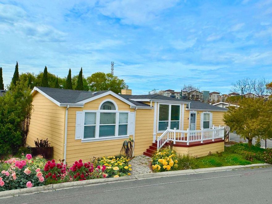 Owner sale!!! Welcome to a splendid 4-bedroom, 2-bathroom home in the vibrant city of Sunnyvale. This sun splashed spacious 1,740 sq ft residence, has a huge east facing Master bedroom, big private bathroom, and east main entry for good feng shui.  Kitchen area has a combination of a dining area with lots of storage.  Enjoy Park amenities including three pools, relaxing spas, elegant clubhouses, and saunas. The high ceiling airy feeling home features various flooring types, including carpet, hardwood, and laminate, providing comfort and style throughout. The living space includes a cozy fireplace, for relaxing evenings. Practical amenities include central AC and central forced air heating for year-round comfort. The laundry area has a washer and dryer. Home is on a corner lot with both front and backyard space. A beautiful, and delicious, mandarin orange tree is in the backyard! Located within the Sunnyvale Elementary and Fremont Union High school districts, this home offers easy access to local schools.  Public transit (VTA) is walking distance and access to both 101 and 237 is close by. For the cost of a down payment for most single houses you have the whole house! With its combination of ample living space and modern conveniences, this Sunnyvale home is a must-see!