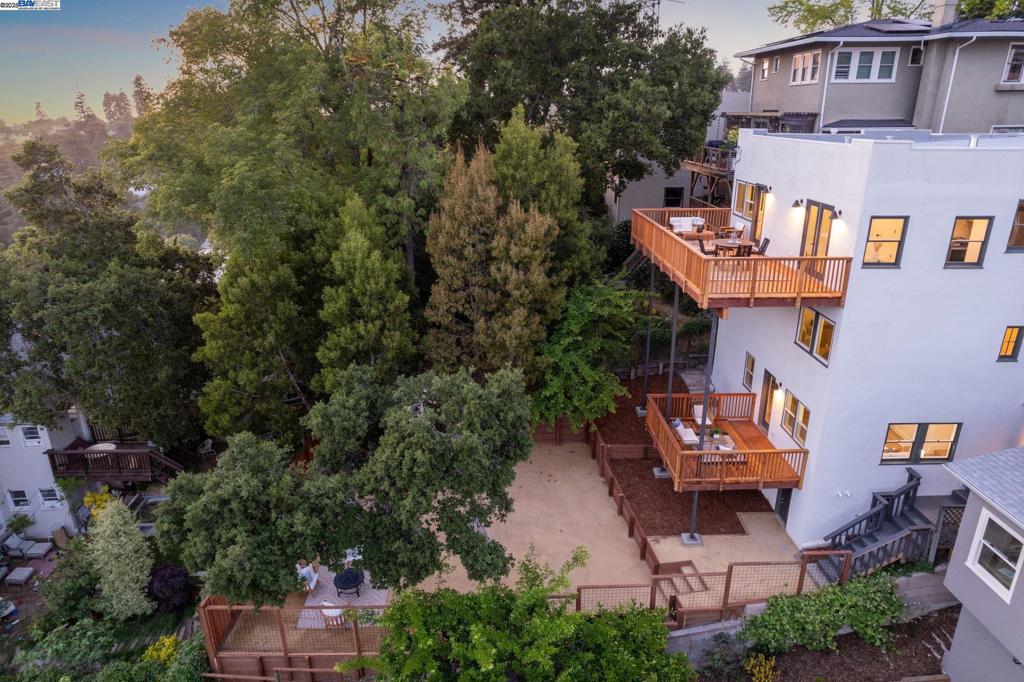 An extraordinary opportunity for an owner occupant or investor, this gorgeous 5+BD/3BA Mediterranean home with a separate 1BD/1BA full-service guest apartment has been reimagined and rebuilt in Oakland’s coveted Glenview neighborhood. Enjoy the luxury and comfort of this 3767 SQFT home while earning income from the large and similarly renovated apartment? With sunny windows all around, the home’s upper floor is a dream for modern living with formal and informal living rooms; a sophisticated, well-proportioned kitchen; an adjacent formal dining room; a flexible space ready as an office or playroom; a full bath; and two sets of French doors onto a grand deck for seamless indoor/outdoor living. Downstairs find another den, a laundry room, and three bedrooms. Two roomy bedrooms share a full bath, while the primary bedroom has a luxurious ensuite bath. In fact, all of the home’s bathrooms boast designer tiling and fixtures. The spacious apartment features the same contemporary design and styling as the home and has its own deck. Surrounded by mature trees, new fencing, and raised beds, the backyard is spacious and sunny. Out your front door, find lively Park Blvd. for shopping and dining, nearby Glenview Elementary, lovely Diamond Park with its swimming pool, trails, and playgrounds.