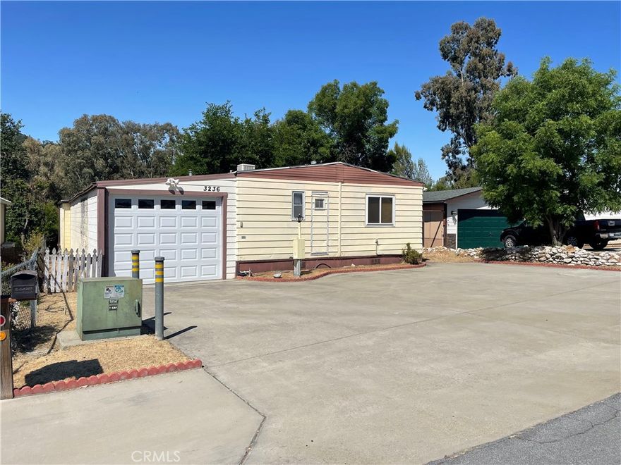 Older home in great location needing a good amount of deferred maintenance addressed. It is a two-bedroom two bath (assessor says 3 beds) unit and has great access and level parking on a cul-de-sac. Within Walking distance to the Pool, dog park, pickle ballcourts and Lake. Newer vinyl windows and rolled roofing. Views to the sought form back of unit overlooking large greenbelt. Decks are not safe. Lower deck and ramp will be removed. there will be a piece of plywood on deck at entry to help support access, but you should not walk out on decks they are not stable.