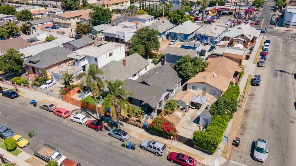 Introducing an outstanding investment opportunity in the heart of Los Angeles, mere minutes away from the prestigious USC campus! This captivating three-unit property showcases two units at the front, each boasting 1 bedroom and 1 bathroom, offering a generous 768 SqFt of living space. In addition, there's a delightful third unit situated at the back, with 2 bedrooms and 1 bathroom, providing a comfortable 580 SqFt of living space. Upon entering the first front unit, you'll be greeted by a welcoming living area, complete with a cooling ceiling fan and a dining area with large windows that allow abundant natural light to flood the space, creating a warm and inviting atmosphere. The kitchen boasts stainless steel appliances and ample cabinet space, perfect for all your storage needs. Convenience is key, as the unit comes equipped with its own washer/dryer, adding an extra layer of practicality. The bathroom features a shower over tub arrangement, and the bedroom offers a spacious walk-in closet, providing an ideal sanctuary for relaxation. Conveniently situated above the two-car garage, the third unit offers a sense of privacy and tranquility, making it the ideal space for tenants seeking a peaceful retreat. With its two spacious bedrooms, both equipped with walk-in closets, this unit offers comfort and style in equal measure. The bathroom includes a contemporary shower stall, ensuring a refreshing start to the day. Situated in a bustling area, this property is surrounded by an array of enticing restaurants, vibrant shops, and an easy access to the freeway, making it a desirable location for tenants seeking convenience and excitement. Don't miss out on this amazing investment opportunity. Take advantage of the thriving Los Angeles market and secure this enticing property today!