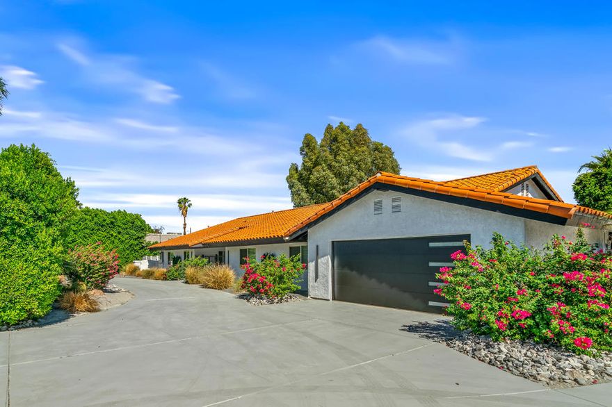Welcome to a rare opportunity to own a truly unique property on a sprawling half-acre corner lot in desirable East Palm Desert. This 3,121 sq ft home offers expansive living space and a layout designed for comfort, entertaining, and functionality.Property HighlightsCompletely Remodeled!  4 Bedrooms/4 Baths.  Detached 30' x 50' RV Garage, perfect for car enthusiasts or RV ownersTraditional 2-Car Garage -- both garages feature Mini-Split HVAC systems.Owned Solar System for energy efficiencyUpgraded Windows, Doors, and Sliders throughoutInterior FeaturesFormal Sunken Living & Dining Rooms, plus a cozy bar area and fireplaceCompletely remodeled chefs' Kitchen with ultra high-end appliances. All bathrooms remodeled with Ultra Modern Bathrooms.Outdoor ParadiseRefreshed Sparkling Pool & Spa with a tranquil creek featureCovered Patio with outdoor kitchen and bar.Mature Landscaping and mountain viewsCircular Driveway and gated parking area -- ample space for vehicles, boats, motorcycles, and more.No HOA, No Mello Roos, No Land Lease
