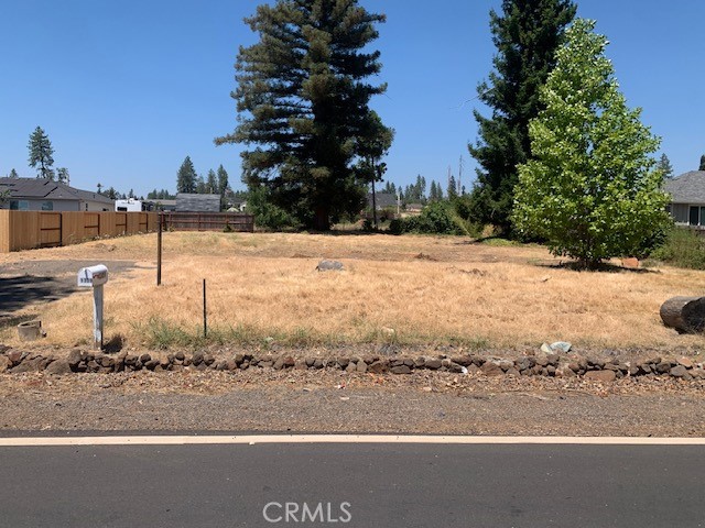 Nice level lot on great street that is close to services. New homes in the area. Beautiful redwood at the back of the lot. Partially fenced. Original home was 1144 square feet two bedroom. Septic condition is unknown. Water service is not active.