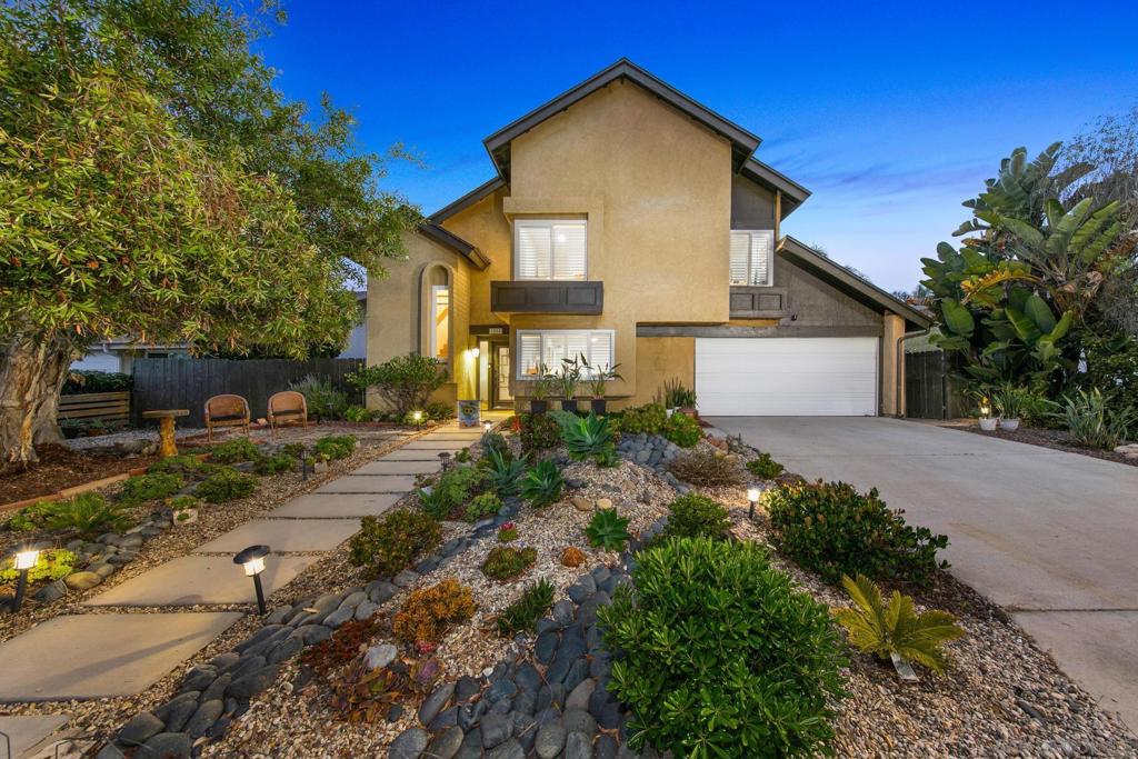 Ideally positioned in the heart of Encinitas, this impeccably updated 4-bedroom, 2.5-bath residence on a 7300 sq. ft. lot offers a harmonious blend of coastal elegance and contemporary comfort. Upon entry, soaring cathedral ceilings and expansive dual-pane windows bathe the interior in natural light, creating a warm and airy ambiance. The grand living room, centered around a gas fireplace, flows gracefully into an inviting formal dining area—perfect for both intimate dinners and festive gatherings. The reimagined chef’s kitchen showcases quartz countertops, custom cabinetry, refined fixtures, a breakfast bar, and recessed lighting, all seamlessly connected to a spacious family room and inviting outdoor living spaces. The first-floor primary suite is a serene sanctuary featuring vaulted ceilings and a spa-caliber ensuite with dual vanities and a custom-tiled walk-in shower. The tranquil backyard is designed for effortless outdoor living, with drought-tolerant landscaping, elegant hardscaping, and two covered trellis patios ideal for alfresco dining or quiet evening relaxation. Upstairs, three generously sized bedrooms and beautifully appointed bathrooms complement the home’s versatile layout. Enhanced with thoughtful upgrades—including luxury vinyl plank flooring, New Roof, energy-efficient windows and sliders, plantation shutters and ceiling fans throughout—this home exemplifies turnkey refinement. Just minutes from iconic beaches and within walking distance to scenic trails, local parks, top-rated schools, and beloved neighborhood markets and eateries, this residence is the very essence of elevated coastal living in Encinitas.