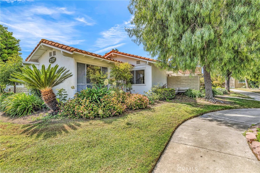 Tucked inside Laguna Woods Village’s guard-gated, 55+ community, this single-level 2-bedroom residence offers easy living close to Gates 5 & 6 and just moments from Clubhouse 4—the community’s creative hub with workshops, studios, and an Olympic-size pool. The efficient footprint pairs a bright living area with an adjacent dining nook and an open-feeling kitchen, while two well-sized bedrooms include a convenient powder/guest bath in addition to the main bath (public record shows 1.5 baths). A covered carport with storage, nearby community laundry, and leafy neighborhood walkways add day-to-day ease. Living here means resort-style amenities at your doorstep: two golf courses (27-hole championship + 9-hole exec), tennis, pickleball, multiple pools/spas, three fitness centers, equestrian center, and 200+ clubs—plus a free internal bus system and 24-hour security. Monthly assessments include water, sewer, trash, and basic cable, with exterior maintenance handled by the association. Minutes to Laguna Beach, medical services, shopping, dinning and entertainment.