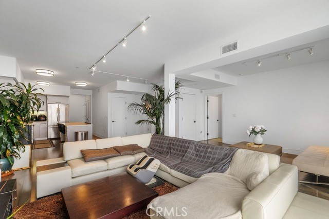 Welcome to this exceptional top-corner unit in the beautiful Avenida Prosser, built in 2011. This rare offering features unobstructed city views from every bedroom and the living room, filling the home with natural light and refreshing ocean breezes. Step out onto the private patio to soak in the sun and enjoy the scenery. Inside, the open floor plan and high ceilings throughout create a bright and spacious atmosphere, perfect for both everyday living and entertaining.
The ensuite primary bedroom feels like a five-star retreat, complete with luxurious Carrara marble finishes. The second bathroom offers a deep soaking tub, ideal for unwinding. A versatile den space provides the perfect setup for a home office or creative nook. Every window is adorned with charming plantation shutters, and the convenience of an in-unit stackable washer and dryer adds to the home’s comfort. The unit includes two assigned, non-tandem parking spaces.
Located in a quiet residential neighborhood near the highly sought-after Westwood Charter Elementary School, this home is also just minutes from Westfield Century City Mall, UCLA, Sawtelle, and major freeways. With its combination of luxury, location, and livability, this rare find is not to be missed.