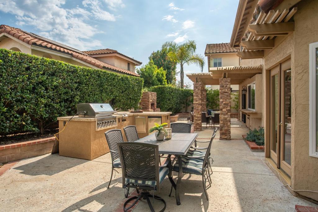 Upgraded 4BR/2.5BA home on a quiet cul-de-sac in prestigious Chateau Del Norte subdivision of Shadowridge. Light and airy with all 4BRs up. Entertainer's dream backyard complete with built-in BBQ, awning, fireplace, and separate sitting and dining areas. Expansive layout with outsized downstairs living and family rooms (with fireplace), and tons of natural light flowing in. Some of the many upgrades in the home include dual pane windows (with blinds), LED lighting throughout, remodeled powder room and primary bathroom (including plumbing), and solar lighting. Newer sprinkler/drip system, stainless steel appliances and granite countertops, light fixtures, engineered wood floors, tile and carpet, and attractive built-ins in the garage. Ample laundry room with sink located inside just off the garage.