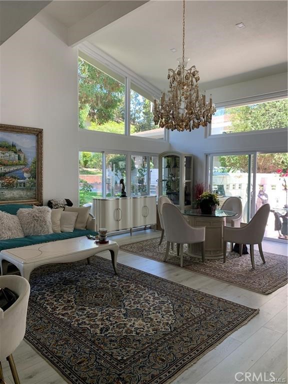 Welcome home to this popular Seville model located in the sought-after 55+ community of Laguna Woods. This spacious floor plan features 2 bedrooms, 2 bathrooms, with an additional loft, providing additional living space that can be used as an office, a hobby room, or an extra guest room. This home has been totally updated that you must see to appreciate it . As you enter the home, you'll be immediately greeted by the beautiful dual pane windows that allow natural light to flood the space, highlighting the vaulted and smooth ceilings that create an open and inviting atmosphere. The new stairs at the middle of the house add a modern look. The central heat and air ensure that you will be comfortable year-round. This unit is located in a park-like setting, which offers a serene and peaceful environment for outdoor activities or relaxation. Located in Laguna Woods, this home is in a prime location, with easy access to shopping, dining, and entertainment options. The community also features convenient transportation services, making it easy to explore nearby attractions and destinations. You'll appreciate the many community amenities, including golf courses, pools, fitness centers, and more. Overall, this home offers the perfect blend of tasteful upgrades and natural beauty, making it an ideal choice for those seeking an active and fulfilling lifestyle in the heart of Laguna Woods. Don't miss out on this incredible opportunity to live at a piece of paradise in this amazing community!