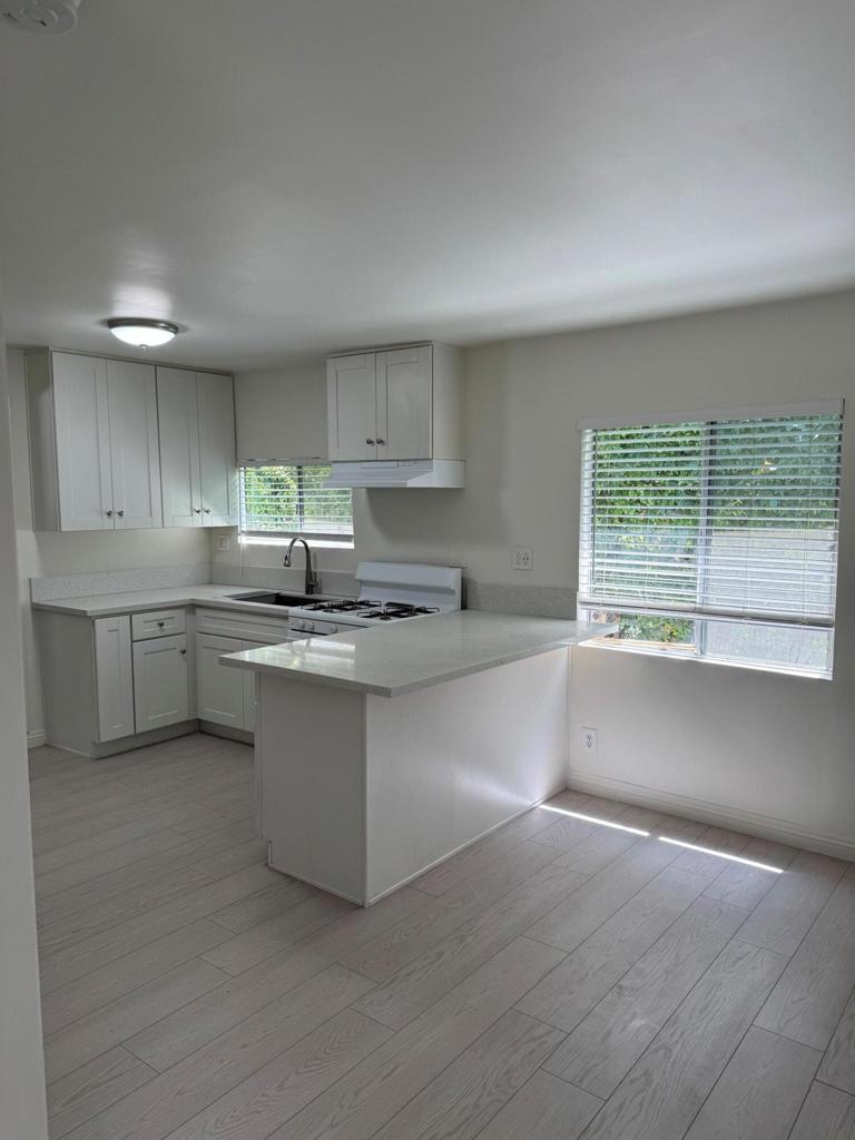 This cute little house behind the main house on the lot is a private little get away. A great alternative to an apartment with no common walls. Small but complete with washer and dryer in the unit.