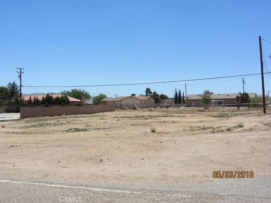 OWNER WILL CARRY!  Bear Valley Road frontage. Great location right across from Victor Valley College!  Zoned as C2. Property is located between Peach and Jacaranda next to existing dental office.