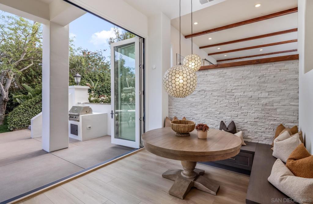Tucked into the peaceful, bucolic hills of Olivenhain’s western countryside, this stunning modern Spanish estate—designed by Blythe Designs and remodeled by AVID Design and Build—offers luxury, space, and timeless design. Soaring 10–14 foot ceilings and a sprawling floor plan create a grand yet welcoming interior with extra bathrooms, a huge garage, and a master retreat complete with a private balcony. Set on a generous lot with over an acre and across from the Little Oaks Equestrian facility and a protected preserve, this home offers serene green views and complete privacy. There’s ample space for a pool, ADU, or future expansion to boost value with no HOA to limit your vision. The quiet street features friendly neighbors and easy access to top-rated schools, the beach, and the freeway. A massive driveway allows for privacy, effortless entertaining and guest parking. With room to grow and views to savor, this one-of-a-kind home blends country charm with refined design in one of Encinitas’ most desirable pockets.