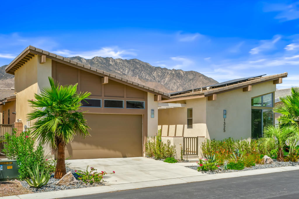 Nestled in the coveted Vermillion area of the prestigious Escena Community, this modern 2,315 sq ft residence offers a rare chance to own a golf course property epitomizing luxurious desert living. This award-winning home features breathtaking mountain vistas and a seamless open floor plan under high ceilings, accentuated by airy windows and sliders. Upon entering, an impressive atrium-style courtyard leads to expansive living and dining areas that flow outdoors. The inviting living room, complete with a gas fireplace, transitions into a state-of-the-art kitchen with a large island, breakfast bar, quartz countertops, and top-of-the-line stainless steel appliances. Custom blinds, with electronic options on the Milgard sliders, ensure privacy and style. The primary suite is a personal retreat with a wall of glass showcasing stunning views, plus a spa-like bath with dual sinks and a generous walk-in shower. The front guest bedroom, with vaulted ceilings and corner windows, features an ensuite bath, perfect for guests or a chic office. The well-equipped laundry room offers ample storage and counter space. Outdoors, indulge in a saltwater pebble pool and spa, surrounded by a professionally landscaped yard with updated irrigation and lighting. The covered patio, gas fire pit, and sunbathing space invite relaxation with panoramic views from the golf course to majestic mountains. Upgrades include solid panel doors, a water softener, a 30-panel solar system, and designer wallcoverings, combining style, comfort, and sustainability. Enjoy the Escena lifestyle with the 18-hole championship Escena Golf Club, fine dining at the Escena Lounge & Grill, and the Bark Park for pets. With low HOA fees and proximity to downtown, this home offers a perfect blend of comfort, style, and community living--an unparalleled Palm Springs experience.