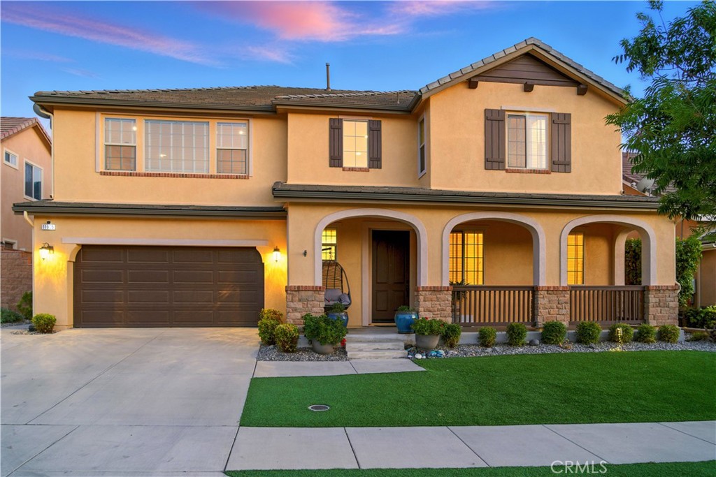 Welcome to luxury and versatility in the heart of the highly desirable Sycamore Creek community in Corona. Nestled against the scenic hills, this stunning 6-bedroom, 4.5-bathroom residence offers over 4,300 sq ft of thoughtfully designed living space, perfect for multi-generational living, entertaining, or simply spreading out in comfort. The downstairs features two spacious bedrooms, including a full NexGen suite complete with its own kitchenette, stackable washer/dryer, and everything needed for independent living. The open-concept layout flows into a chef’s dream kitchen, showcasing granite countertops, stainless steel appliances, lots of storage, a drinking water alkaline system, an oversized walk-in pantry, and a massive center island that seamlessly connects to the dining area and living room. Enjoy gatherings in the elegant living space with a cozy fireplace and wall-to-wall sliding doors that open to a fully covered outdoor patio—perfect for indoor-outdoor entertaining year-round.Upstairs offers a spacious loft, three additional oversized bedrooms with generous closets, and a large laundry room for convenience. The primary suite is a true retreat, approximately the size of two bedrooms, with a grand walk-in closet and a luxurious ensuite bath featuring dual vanities, a soaking tub, and a separate glass-enclosed shower. Step outside to your private entertainer’s paradise—a beautifully landscaped backyard with turf, a stunning newer pool with rock slide and lighting, a gas fire pit, and room to relax and play. Additional upgrades include paid-off solar, a whole-house water softener, and a 220V outlet in the garage for electric vehicles or tools. Located in a community with resort-style amenities: clubhouse, fitness center, pools, spas, walking trails, security, and planned resident events. Conveniently close to top-rated schools, shopping, and easy access to major freeways. This is more than a home—it’s a lifestyle. Schedule your private tour today!