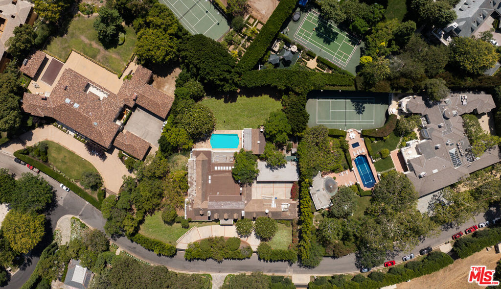 Encompassing approximately one flat acre of pristine, usable land, this remarkable parcel offers the perfect canvas for creating a world-class residence that combines architectural grandeur with the privacy and elegance of one of L.A.'s most elite streets. Surrounded by mature trees and nestled among some of the city's most iconic homes, this timeless property exudes tranquility and sophistication. Included in the offering are plans for a magnificent 23,500-square-foot warm Transitional modern estate designed by Harrison Design, with interiors envisioned by Clements Design. These thoughtfully conceived plans are currently in the final stages of the approval process, significantly reducing the timeline to begin construction on what is poised to be a truly exceptional residence. The proposed estate showcases a harmonious blend of classic architecture and modern luxury, featuring expansive living and entertaining areas, state-of-the-art amenities, and seamless indoor-outdoor flow. Designed for both large-scale entertaining and intimate everyday living, the home will stand as a testament to timeless design. The square footage of the proposed estate can be reduced and the layout can be customized based on the Buyer's preference. Delfern Drive offers unparalleled potential to craft a legacy estate in a location that continues to define prestige, exclusivity, and value. This is truly a once-in-a-generation offering in one of Southern California's most sought-after enclaves.