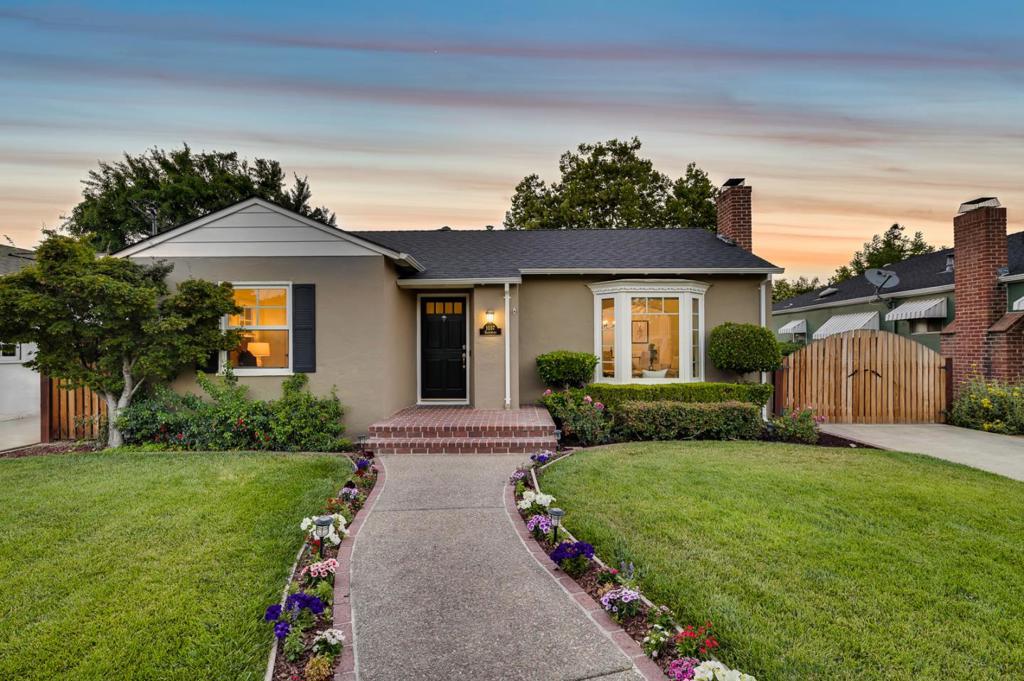 CHARMING REMODEL IN WILLOW GLEN | Nestled along a peaceful street, this picturesque, updated home within blocks of Downtown Willow Glen is an inviting blend of traditional charm and modern luxury. Must-have features include hardwood floors, graceful arches, skylights, and a stately fireplace. The living and dining rooms are fitted for elegant entertaining, while the open, sky-lit kitchen and family room permit casual enjoyment. The tastefully remodeled kitchen offers premium countertops, a breakfast bar, and stainless appliances, including a gas range and convection oven. Custom closet storage and an en-suite bath with mosaic details enhance the sunny primary bedroom. Relax outdoors on a private patio overlooking the pleasant backyard. Includes a new roof, gated drive, updated baths, and a detached two-car garage. Near beautiful River Glen Park and sought-after Booksin Elementary (buyer to verify).