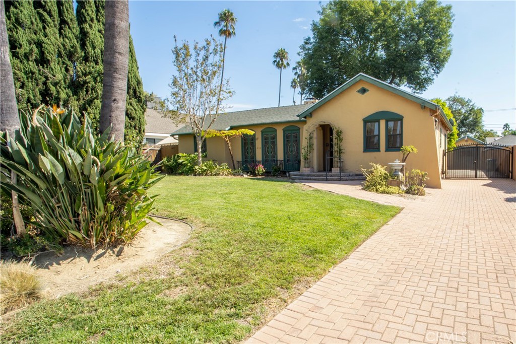 Welcome to this spacious hacienda ranch-style home in the highly sought-after Madison Heights neighborhood of Pasadena. With brand new refrigerator, gas stove top, and new paint and light fixtures, this is an opportunity you will not want to miss. The main residence features a formal living room with an original Batchelder fireplace, a formal dining room, a generous eat-in kitchen, laundry room, guest bath, two guest bedrooms, a large primary bedroom, a bathroom offering both tub and shower. A bright family room with sliding doors opens to the backyard, creating seamless indoor-outdoor living. The converted garage adds versatility with two additional rooms plus two large storage areas—perfect for a home office, studio, or guest accommodations. Step outside to an expansive backyard retreat with fruit trees, a sparkling pool, gazebo, and multiple outdoor lounge and dining areas ideal for entertaining. With 1,792 sq. ft. in the main house and 620 sq. ft. in the garage conversion, this property offers comfort, flexibility, and charm in one of Pasadena’s most desirable neighborhoods.