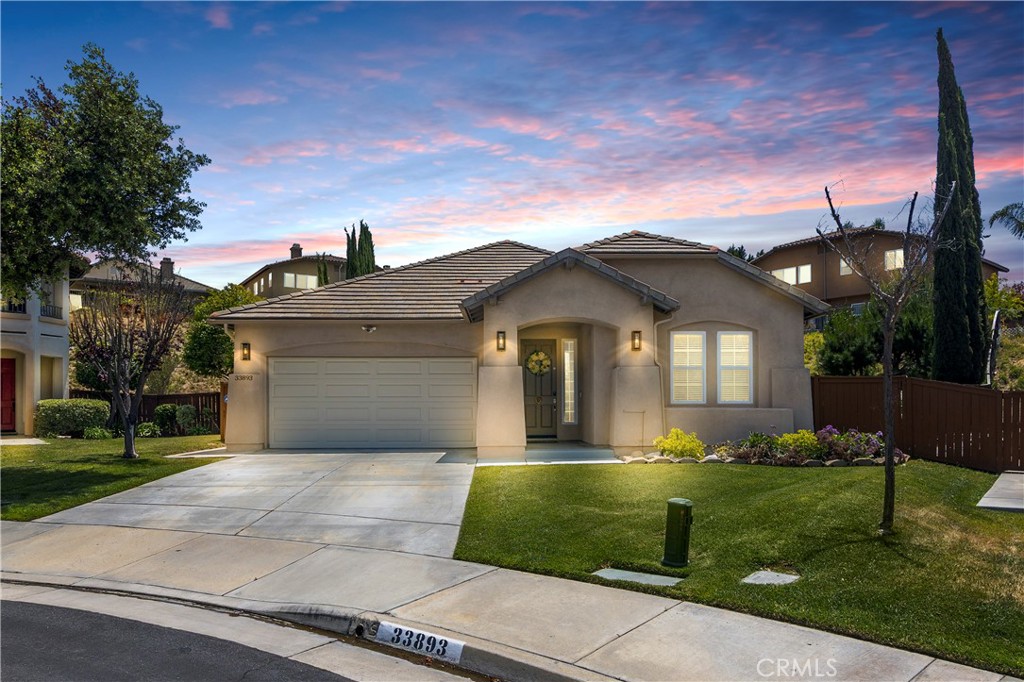 True turnkey in Morgan Hill. Tucked at the end of a quiet cul-de-sac, this fully renovated single-level home delivers modern style, easy living, and a pool-sized lot with a private spa. Every space has been thoughtfully updated so you can move right in and start enjoying life. Step inside to an airy, open layout with luxury vinyl plank flooring, fresh paint, recessed lighting throughout, and a sleek glass fireplace. Natural light pours in, and every bedroom includes a ceiling fan for year-round comfort. The designer kitchen is the heart of the home with white shaker cabinetry, quartz countertops, pendant lighting, and an extended island made for everyday meals and weekend gatherings. Brand-new appliances, a whole-home water softener, and a reverse osmosis system elevate daily living. Double doors lead to a serene primary suite with a spa-inspired bath, separate tub and shower, quartz dual vanity, and two generous walk-in closets. The secondary bath is beautifully redone with a custom vanity and modern finishes. Outside, entertain under the Alumawood patio cover, relax in the private spa, and enjoy beautiful landscaping with abundant room for a future pool. As a Morgan Hill resident, you’ll enjoy a resort-style clubhouse with an Olympic-size pool, tennis and pickleball courts, a full gym, and year-round community events—all within the boundaries of Temecula’s top-rated schools, including Great Oak High School. This home also boasts an unbeatable location with quick access to the I-15 freeway and just minutes from Old Town Temecula, Wine Country, and Pechanga Resort & Casino. A rare find, this true turnkey gem is ready for you to move in and start living.