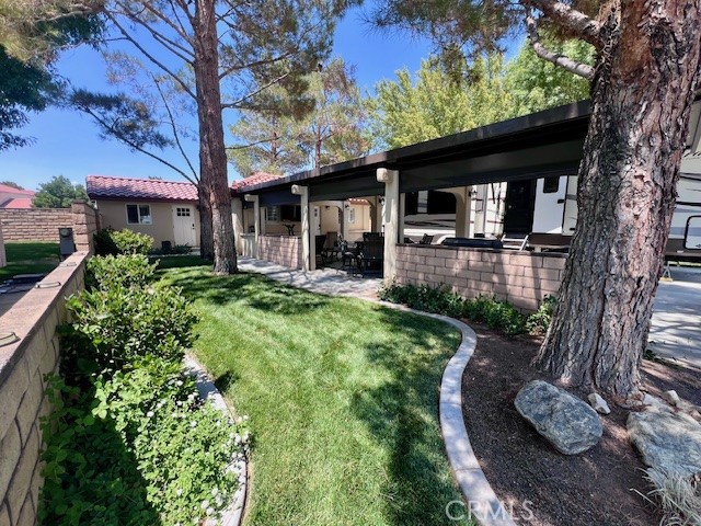 **WELCOME TO JESS RANCH RV RESORT** This Beautiful LOT in a charming GATED COMMUNITY! Property includes a **STUNNING CASITA AND BONUS ROOM** (recently remodeled), complete with heating/air, full bathroom with walk-in shower, washer/dryer and full size refrigerator. Enjoy serenity and quietness under the extra large covered patio with electric shades. Oversized concrete drive way with plenty of room for 3 vehicles.
PLUS...a HOT TUB - a special private retreat tucked away in the back of the property under a covered patio. This property is truly a delightful paradise with lush grass, mature trees and gorgeous block walls. Buyer must bring in RV under 10 yrs old and a minimum of 26ft in length. HOA includes water, trash and lawn maintenance, along with community pool, spa, laundry facilities and clubhouse with gym, game area, pool table and large kitchen.
Conveniently located near grocery stores, restaurants, retail stores and movie theater. A MUST SEE, whether you're a snowbird or a full-timer, **RV RESORT LIFESTYLE** you can enjoy nature and community without sacrificing convenience and luxury! Schedule a viewing today!!