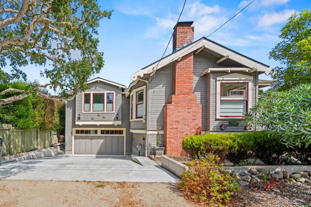 Classic Queen Anne Victorian, circa 1906 is located in the Washington Park area of Pacific Grove, where the Monarch butterflies' winter. Extensively remodeled in 2012, then later a great room, 2-car garage, driveway, plus retaining wall added and reconstructed in 2022. This home showcases high ceilings, gleaming wood flooring, Parisian style black and white tile bathroom and lush gardens on an oversized lot. There's a secret children's playroom located in the previous carriage house.