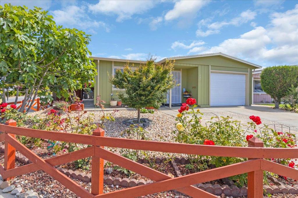 Welcome to your new home in Watsonville! This charming residence offers 1,038 sq ft of comfortable living space, featuring two bedrooms and two full bathrooms. The thoughtfully designed kitchen is perfect for culinary enthusiasts, ensuring convenience and functionality. A cozy dining area provides a perfect spot for family meals and gatherings. The home is equipped with forced air heating, making it a cozy retreat during cooler months. Although there is no cooling system, the mild Watsonville climate makes it manageable. For added convenience, the laundry area is situated within the home, simplifying daily chores. The living space is enhanced by a beautiful fireplace, offering warmth and ambiance. The property features attractive flooring throughout, complementing the home's overall aesthetic. With a two-car garage, you'll have ample space for parking and storage. Located in the Pajaro Valley Unified School District, this home ensures access to local educational facilities. Don't miss out on this opportunity to own a lovely home in Watsonville!