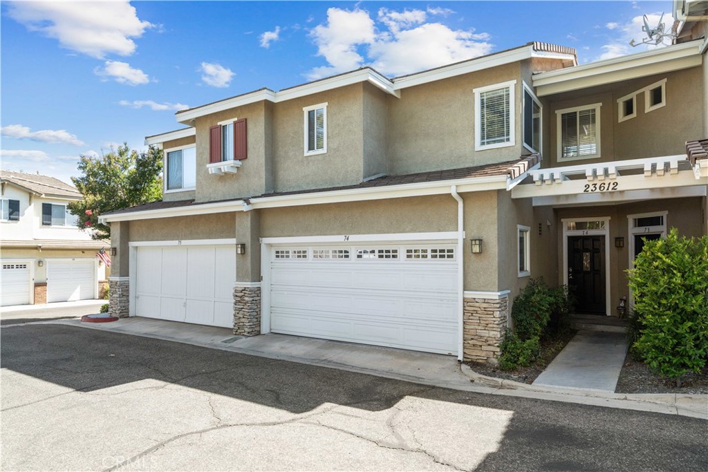 Unwind and enjoy your summer nights sitting on the patio lounge chairs while gazing into the Sunset. The orientation of this home has a west-facing backyard and east-facing front door allowing natural lighting all around, presenting the property light and bright. In the heart of the City of Santa Clarita and the highly desired area of Valencia Northbridge in the Montana Townhomes! The location of the home is great being near the guest-parking spaces, and has no direct backyard neighbor. There is a 2 car garage attached with direct access to the Kitchen. Through the Kitchen you’ll notice upgraded cabinetry, countertops, and stainless steel appliances. Throughout the home there are Laminate planks, tile in the bathroom, and no carpet whatsoever. Each bedroom has its own private full bathroom inside, downstairs features a guest bathroom for visitors. The HOA amenities include Roof coverage for the property, maintenance for the common grounds such as the greenbelt and the HOA pool and spa. The home is nearby award-winning schools, the Bridgeport market place, 3 City parks, and the famous Santa Clarita Paseo walking trails. No Mello Roos tax bonds.