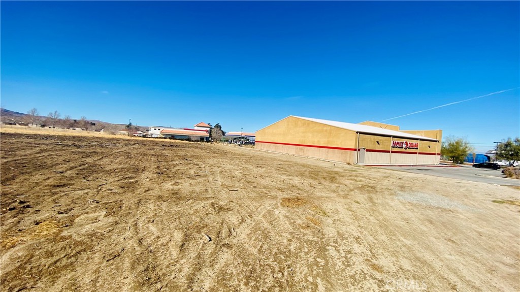 An incredible opportunity awaits with this 6.0141-acre parcel of flat, buildable land located in the heart of Downtown Littlerock, CA. Zoned for both commercial and agricultural use, this property is ideally situated for development or investment, offering exceptional visibility and access. It sits directly behind Family Dollar, next to AutoZone, and across from McDonald’s, making it a high-traffic location with excellent exposure. The lot is located at the end of paved 85th Street, providing convenient access while still maintaining a prime corner of the growing commercial corridor.
The property is development-ready with a water meter on-site and other utilities available at the street. All groundwork has been completed, including the land survey, topography report, and Certificate of Compliance, saving you time and money in the planning process. The lot is suitable for a wide range of potential uses, from retail or service-based businesses to agricultural operations or a hybrid commercial/agricultural project.
Whether you're an investor looking for a high-potential parcel, a developer ready to break ground, or a business owner seeking a strategic location, this property offers flexibility and long-term value. All information is deemed reliable, but buyers are advised to conduct their own due diligence with the County of Los Angeles. The seller is highly motivated, bring your vision and your offer. Opportunities like this in Littlerock’s commercial core don’t come around often!