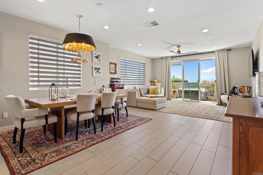 Back on Market! Welcome to this breathtaking, turnkey, luxury townhome, situated in the most wanted location of Carlsbad's Bressi Ranch community. This magnificent Premium lot, West facing end unit offers ocean and sunset views all while enjoying refreshing coastal breezes from the comfort of your own home. Flooded with natural light, this impeccably upgraded residence blends style, comfort, and efficiency. Highlights include a dual zone A/C, tankless water heater, EV charger hookup, smart home tech and solar panels. Curated interior design details feature custom window treatments, dimmable LED lighting, pendent lighting , upgraded wood-look tile flooring, plush carpeting, and custom fans. The entry level boasts a private bedroom with en-suite bathroom and its own spacious private patio. The second level offers a spectacular open concept living area, anchored by a chef's kitchen complete with upgraded shaker cabinets, quartz countertops, stainless steel appliances, walk in pantry and an amazing 11' chef's dream island perfect for entertaining. The bright and airy great room, framed by large windows and featuring a custom overhead fan, seamlessly extends to a private outdoor balcony, ideal for enjoying coastal sunset views. Upstairs, the third floor showcases a luxurious primary suite with sweeping ocean views. A private slider allows for fresh ocean air and abundant natural light. The lavish en-suite bathroom offers an oversized walk-in shower and elegant finishes, while the custom walk-in closet blends beauty and functionality. Custom elegant lighting adds an extra layer of sophistication to this exceptional retreat. There is also a second generously sized bedroom with its own en-suite bath. This is coastal North County living at its finest, luxurious, modern, and move-in-ready, all just steps away from the Bressi Ranch Village Center with markets, restaurants and so much more.
