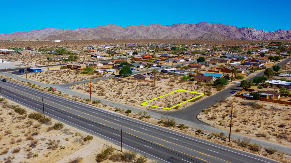 Prime Commercial Lot on Outer Hwy 62 South - Endless Possibilities in the Heart of 29 Palms. Opportunity knocks in one of the High Desert's most promising communities! This commercial lot is ideally located just two blocks west of Oasis Cove Liquor Market, right off Highway 62 - a major corridor with high visibility and steady traffic flow. With water and electricity nearby (service not yet established), you're already a step ahead toward bringing your business vision to life. Whether you're dreaming of opening a mechanic shop, boutique market, local eatery, or launching a completely unique venture, this lot offers a blank canvas with serious potential. 29 Palms is a city on the rise, filled with creative energy, an ever-growing population of families and entrepreneurs, and a strong sense of local pride. As the gateway to Joshua Tree National Park's North Entrance and home to a thriving arts scene and the Marine Corps base, this desert town is full of character, charm, and untapped opportunity. Bring your vision and be part of the next wave of thoughtful development in this inspiring desert community. Your future business belongs here.