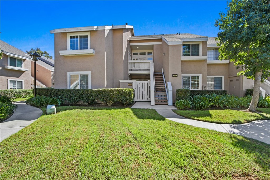 We present this excellently located upper end unit in the desirable Woodbridge Alders tract. This 3 bedroom, 2 bath spacious, largest Alders floor plan enjoys volume ceilings, interior laundry with included Samsung washer & dryer, living room with fireplace, three bedrooms with the primary bedroom on one side of the home and the secondary bedrooms on the other side. The dining room & kitchen combination showcases white appliances including Samsung refrigerator, white cabinetry, granite countertops;, stainless double sink, gas range & built-in microwave. The bedrooms offer ample storage space with custom-built-ins & recessed lighting. Upgrades include new carpet & paint in grey hues, recessed lighting, tract lighting, white brick fireplace hearth & mantle & more. One covered parking space is reserved for this unit (#232). Take advantage of country club like Woodbridge amenities including parks, pools, tennis clubs, lagoons & so much more. Added pluses are close proximity to shopping, award winning Irvine schools & transportation.