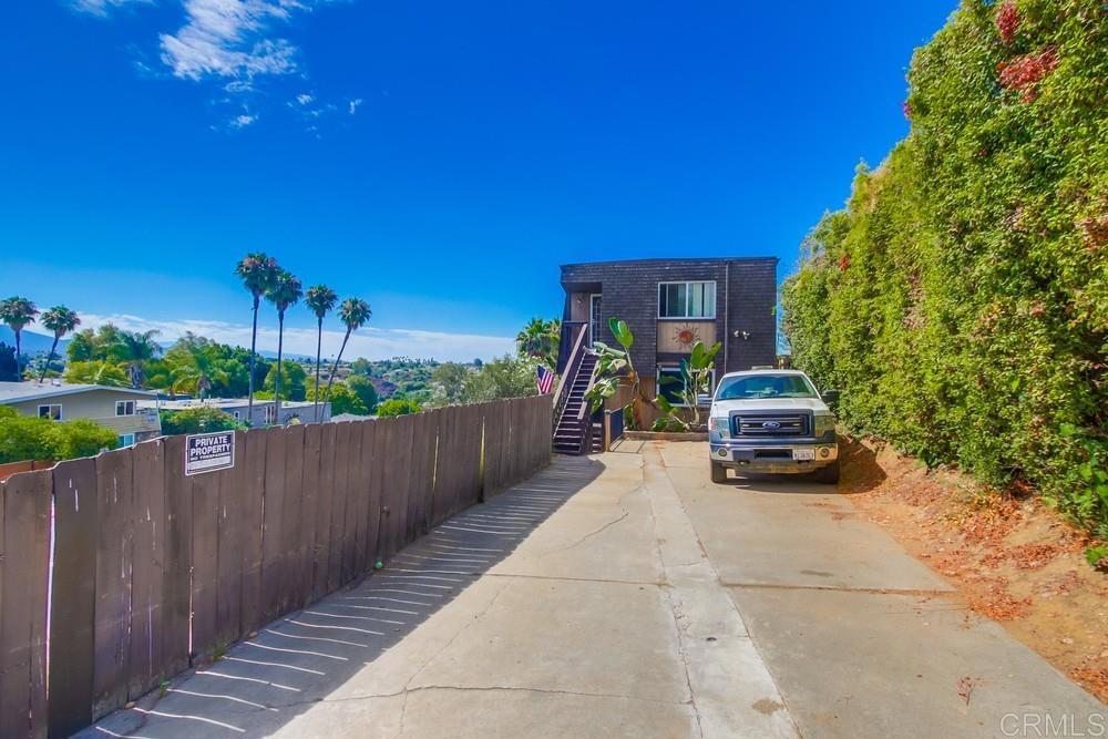 There are only two units in this building, one up and one down, no HOA or HOA fees! This beautiful unit was updated just under 2 years ago. Open concept layout, large kitchen area with island completely open to the living area. Generous primary bedroom with en suite bath and in unit laundry. The secondary bedroom is good size as well. This property is located on a hill at the end of a cul-de-sac which offers plenty of privacy and views of the surrounding areas and mountains. Shared storage area below. New roof in 2024. The owners of the units share common interest in the land. Unit #1 parking in driveway is on the right side Great primary home, investment property or possible vacation rental.