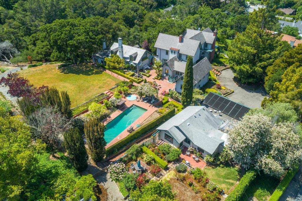 Designed by famed architect George H. Howard & custom built in 1916 for renowned author & conservationist Stewart Edward White, this outstanding 2-acre estate features majestic trees, vast level lawn area, pool, fruit orchard, rose & vegetable gardens, a large guest house w/separate driveway, & a detached ballroom w/soaring cathedral ceiling, massive fireplace, dining room, kitchen & full bath. The main house offers over 4,500s.f. of living space, including a tremendous salon w/regal fireplace, redwood-paneled walls, wet bar, & amazing vistas of the verdant grounds. Additional features include a grand formal dining room, sun-filled chef's kitchen w/nook, cozy family room, remodeled master suite w/spectacular sitting room, fireplace, & marble bath w/heated floors, & a full basement w/large-capacity wine cellar. This magnificent residence is being offered for the first time in 32 years & presents a rare opportunity to own a one-of-a-kind property in lower Hillsborough. (NOT HISTORICAL).