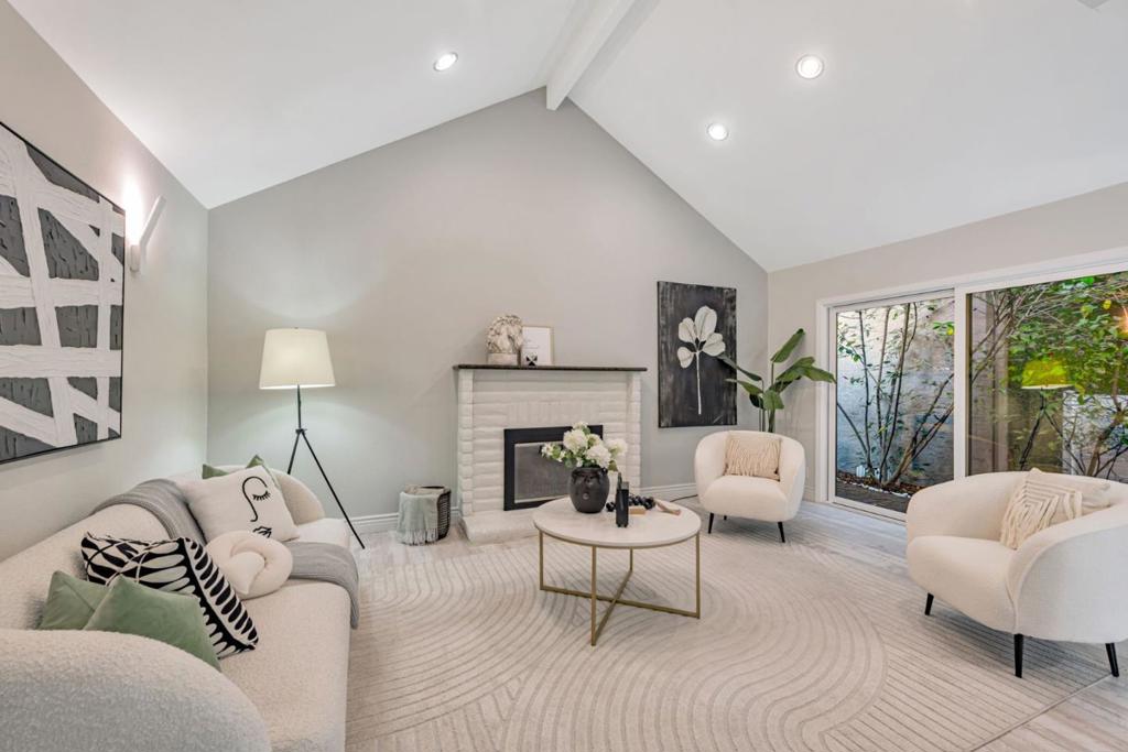 Craving a top tier schools without the steep price tag? Look no further! This exceptional home is zoned for Alta Vista ES, Union Middle, and Leigh High are among the most sought after schools in San Jose. Perfectly situated on the border of Los Gatos, this cozy townhome has a lot to offer! Open floor plan featuring vaulted ceilings and abundant natural light. A chic barn door and updated fireplace add unique charm to the living room. The ground floor offers a versatile room that can serve as a guest bedroom or a home office. The kitchen is a chef's delight, boasting sleek designer cabinets, modern stainless steel appliances, and recessed lighting. The second floor has two master suites, providing ultimate privacy and comfort. Throughout the home, beautiful laminate flooring adds a touch of elegance and durability. Double pane windows and sliding doors insulate the whole house. Stay comfortable year-round with a two-zone heating and cooling system. Enclosed back patio, with stylish flooring, charming greenery wall, and flourishing fruit trees create a relaxing, intimate atmosphere. Attached two-car garage. Only the garage sharing a wall with neighbors. THIS UNIT DOES NOT FACE LOS GATOS ALMADEN RD! Close to shopping, easy access to Hwy 85, and 8 min drive to Downtown Los Gatos.