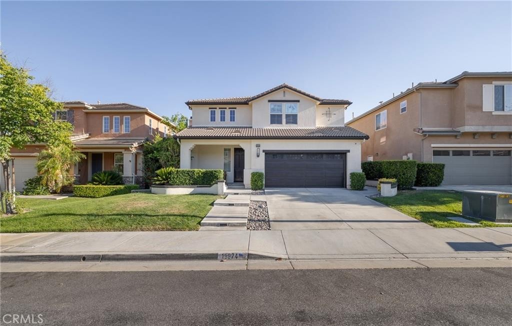 Welcome to 19924 Via Joyce Dr, a spacious and beautifully maintained 5 bedroom 3 bathroom home nestled in a desirable Santa Clarita neighborhood with no HOA or Mello Roos. Boasting approximately 2800 square feet of living space, this residence offers an ideal layout for both everyday living and entertaining.
There is a bedroom on the first floor with an adjacent full bathroom, perfect for an in law suite or guest quarters. The heart of the home is the open concept kitchen featuring a large center island, perfect for gathering with family and friends. The living room is equipped with ceiling speakers, great for hosting or enjoying movie nights.
The home also features a bar area with built in shelves that can be transformed into a cozy lounging area, ideal for entertaining. The 3 car garage has been upgraded with epoxy flooring, fresh paint, and built in cabinets and racks for storage.
The inviting primary suite includes a generous walk in closet and a spa like ensuite bath offering a peaceful retreat. Throughout the home, you will find ample storage and well sized bedrooms to accommodate a variety of needs. Step outside to enjoy the private backyard with a built in grill, perfect for outdoor dining and relaxing summer evenings. Conveniently located near top rated schools, shopping, dining, and parks, this turnkey home is ready to welcome its next owner.