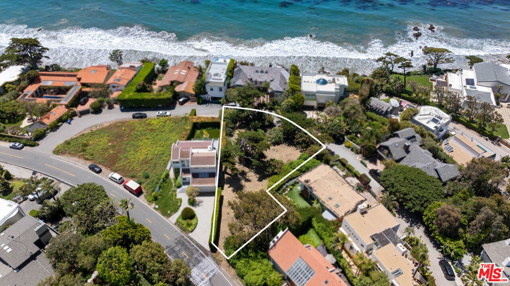 This exceptional property presents a rare opportunity to create a bespoke coastal estate in one of Malibu's most prestigious neighborhoods. Encompassing just over a quarter of an acre of flat, usable space, this undeveloped lot offers dual frontage with convenient access from both Broad Beach Road and Seafield Drive. The upper portion of the property enjoys peek-a-boo ocean views, while deeded access to the exclusive, gated entrance to Lechuza Beach just down the street puts the sand and surf mere moments away. For those seeking an expanded coastal footprint, the neighboring residence at 31830 Broad Beach Road (APN: 4470-025-012) is also available for purchase. This European-inspired villa could serve as your seaside pied-a-terre while you envision, plan, and design a larger estate on the two contiguous parcels. Nestled among multi-million dollar homes, this flat lot invites a vision as unique as its setting. This is more than just a homesite - it's a chance to craft your legacy along one of Malibu's most iconic stretches of shoreline, where luxury, privacy, and proximity to the ocean exist in perfect harmony.